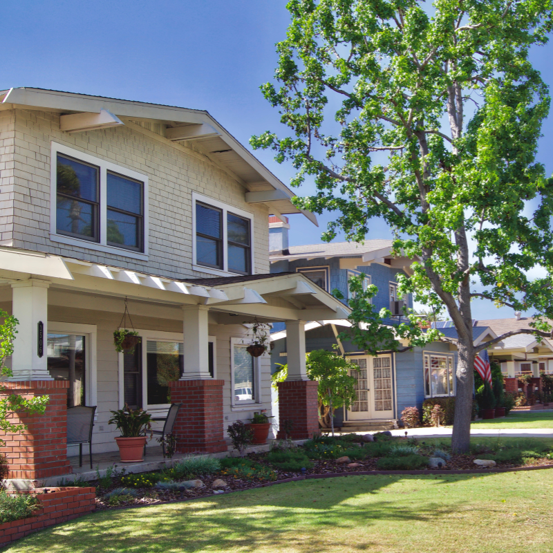 Photo of a neighborhood and two houses. See how we can help protect your home. 