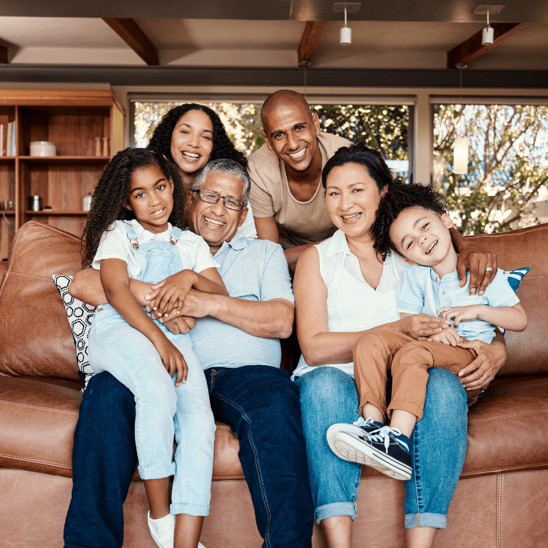 Family sitting on couch. Find what policy is right for your home, so you can also have peace of mind. 